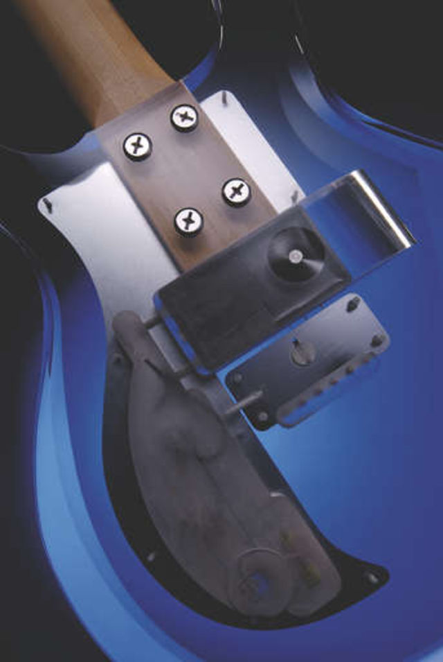 The extended neck is attached to the body by four chunky bolts